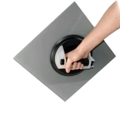Person using 8 Inch Pump Activated Vacuum Lifter With One Hand Operation on a metal sheet.
