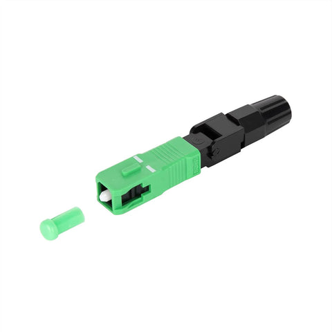 SC/APC fiber optic fast connector in green housing with protective cap and black coupling.