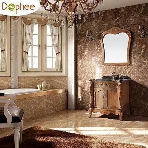 Luxurious bathroom with marble walls, ornate wooden vanity under decorative mirror, and elegant chandelier.