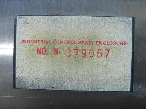 Label on used industrial control panel enclosure N 379057 ready to roll, showing serial number and enclosure specifications.