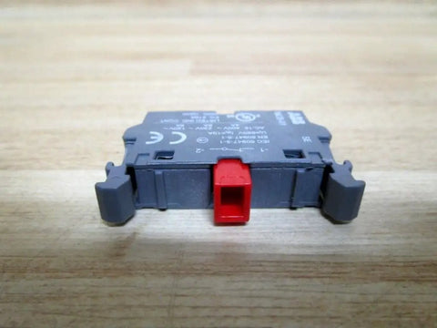 1-NC Modular Snap-On Block for Push Button Switches with self-cleaning terminals on wooden surface