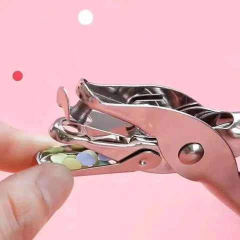 Close-up of compact single hole punch metal circle punch for scrapbooking and office use, 6mm hole puncher with waste holder.