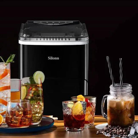 Countertop Ice Maker 9 Bullet Ice Cubes In 6 Minutes Self Cleaning With Scoop next to various drinks