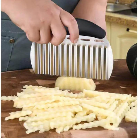 Person using Heavy Duty Stainless Steel Crinkle Cutter For Potatoes And Veggies Wavy Chopper Slicer For French Fries Carrots Apples Onions And Fruits Dishwasher Safe Ergonomic Non Slip Handle Black Style II 1 Piece on potato