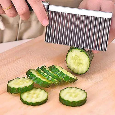Wavy Crinkle Cutting Tool for Veggies and Fruits with Serrator Blade Dope Salad Chopper Knife slicing a cucumber on a board