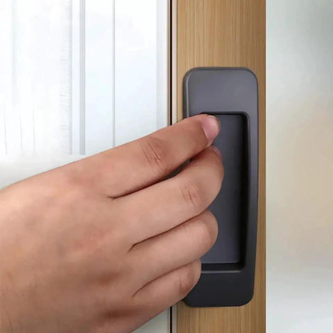Hand using Self Stick Instant Cabinet Drawer Handle Multipurpose Stick On Handle For Kitchen Cabinets Doors And Windows Easy Opening