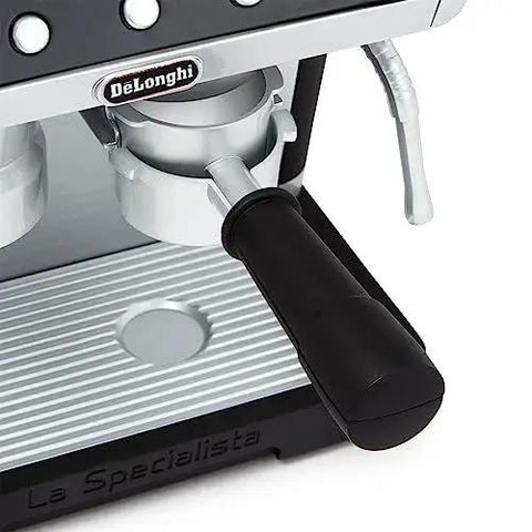 Close-up of Casdon De'Longhi toy espresso machine with black portafilter handle and silver body.