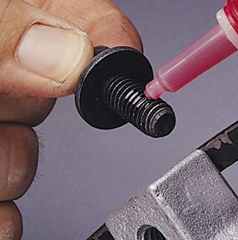Applying High Strength Automotive Threadlocker Red For Metal Fasteners That Stand Up To Heavy Vibration And Oil Exposure With Bright Fluorescent Finish
