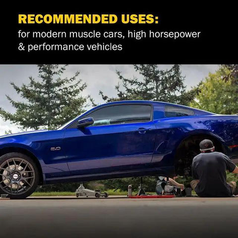 PowerStop front brake pads on blue Chevrolet Corvette being installed; mechanic under vehicle