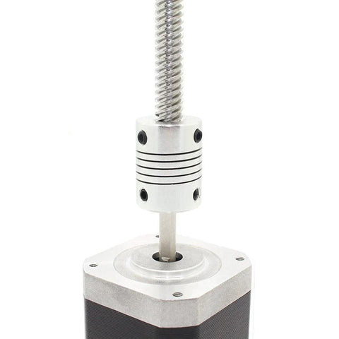 ReliaBot flexible coupling, silver metal, 5–8 mm bore, mounted on a NEMA 17 stepper with T8 lead screw