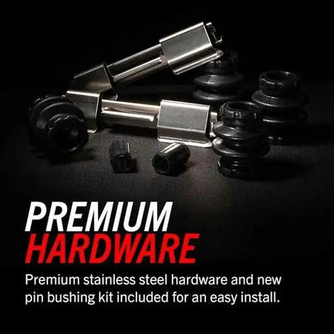 Close-up of front brake pad installation hardware kit featuring silver pins and clips with black rubber bushings