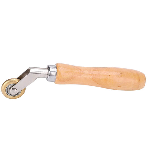 Seam roller with wooden handle and brass wheel for roofing membranes and wallpaper