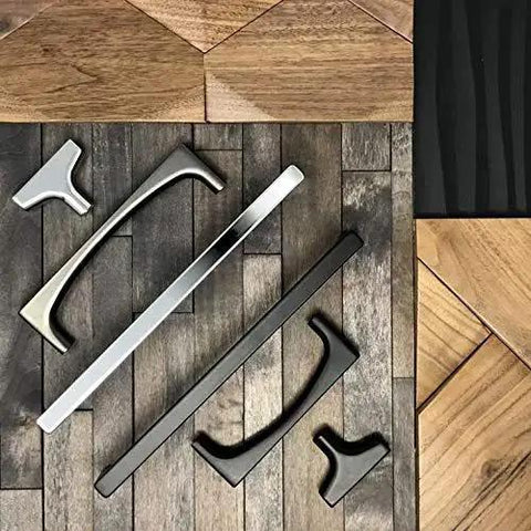 Assorted cabinet pulls displayed on wooden panels, including Riverside Pull In Honey Bronze Finish, 5 1/16 Inch Length, T Shaped Bar Handle.