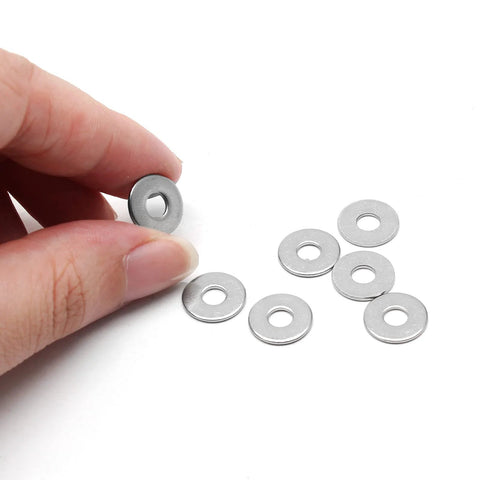 M4 stainless flat washer, 12mm outer diameter, 1mm thick; several washers on white background, one held by fingers