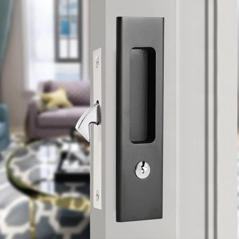 Privacy Pocket Door Lock Hardware 6.3 Inch Sliding Barn Door Lock with keys, mounted on a door, black zinc alloy and copper.