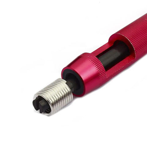 Close-up of a red installation tool with M6 Wire Thread Inserts For 6mm Drill, 1mm Pitch, 2D Length Helicoil Coiled Wire Inserts In 304 Stainless Steel Metric.