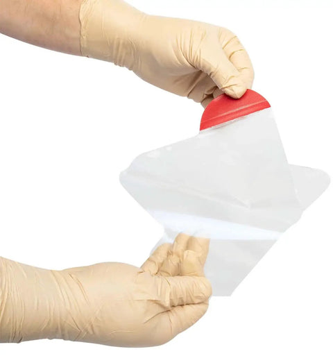 Person holding Twin Pack HyFin Vent Chest Seal for trauma and wound care with three channel pressure relief vents