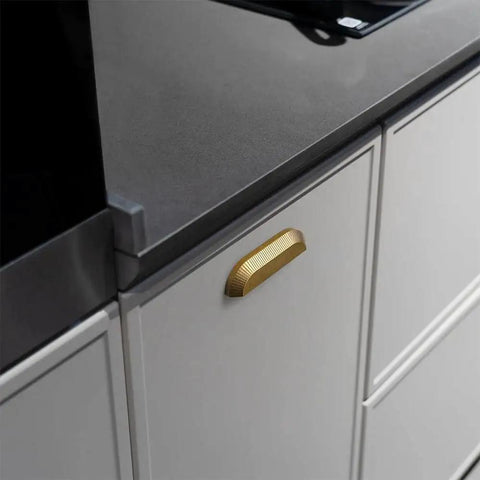 Six Pack 5 Inch Antique Brass Half Moon Cabinet Cup Handles installed on kitchen cabinet