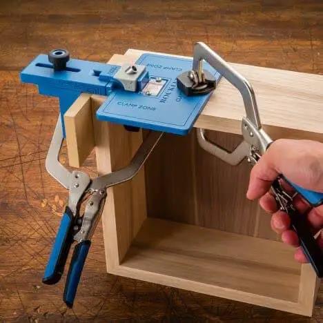 Corner Key Doweling Jig for Decorative Mitered Joints With Molded Reference Lines and Drill Guides, Pro Grade Dowel Tool Kit in use on wood.