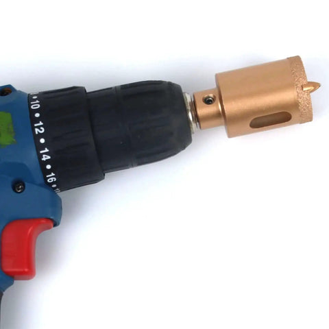 Two Pack 1 1/4 Inch Diamond Hole Saw Kit With Vacuum Brazed Core Drill Bit attached to a standard hand drill
