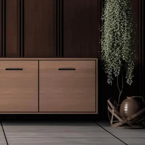 Set Of 30 Matte Black Cabinet Pulls, 5 Inch Length, 3 Inch Hole Centers, shown on wooden cabinet drawer