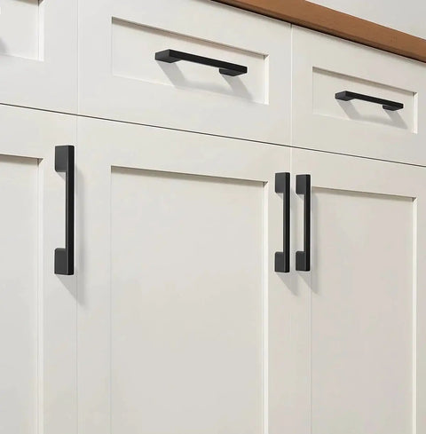 Modern kitchen cabinets with black square handles for smooth operation and coordinated decor