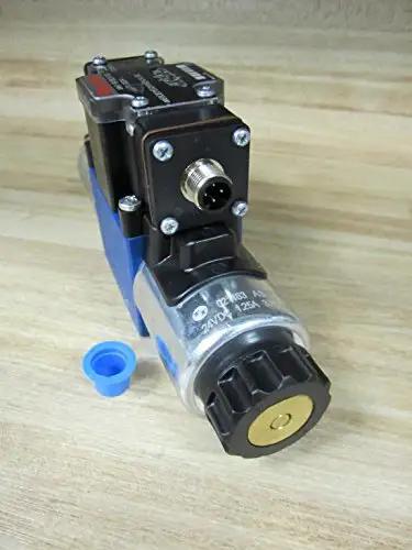 Solenoid directional valve R978024163 4WE6Q62/EG24N9DK24L/62 single unit 24VDC 1.25A 4-pin male connector placed on table