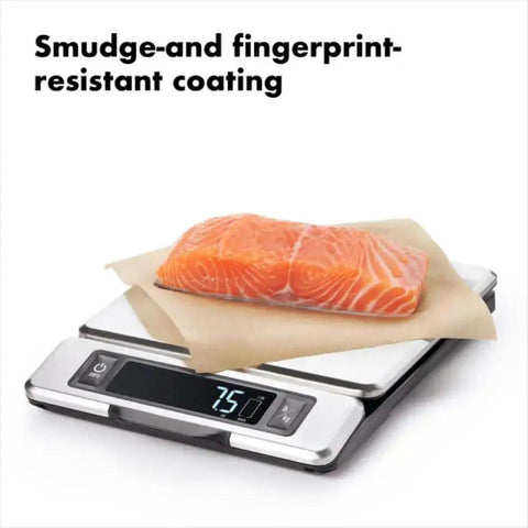 Stainless Steel Kitchen Scale With Pull Out Display, 11 Pound Capacity showing 7.5 lbs with salmon on fingerprint-resistant surface.