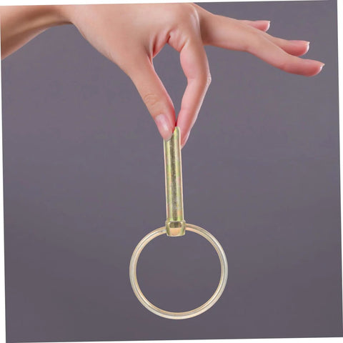 Hand holding a pin from 12 Piece Beefed Up Tractor Trailer Hitch Pins Kit With Heavy Duty Retaining Pins And Rings for secure towing.