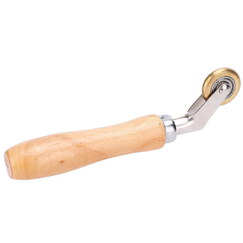 Seam roller with wooden handle and brass wheel for roofing membrane installation