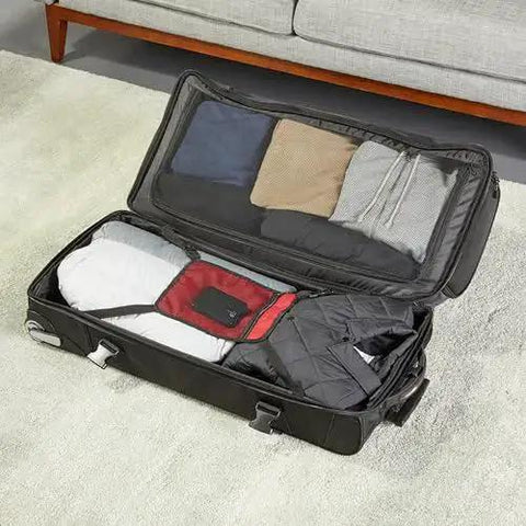 Massive 35 Inch Rolling Duffle with wheels and telescoping handle shown open with clothes inside, black Amazon Basics.