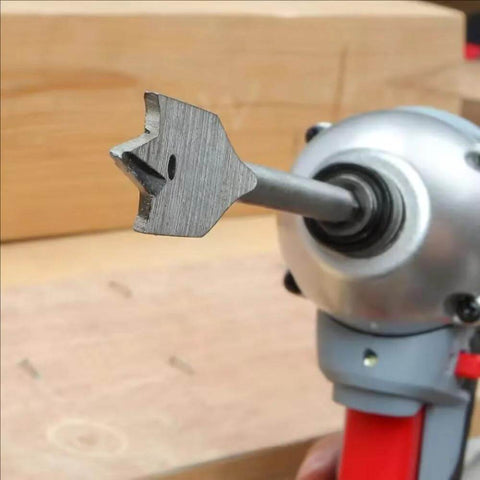 Close-up of spade drill bit from Six Piece Spade Drill Bit Set With Quick Change Hex Shank For Woodworking, attached to a drill.