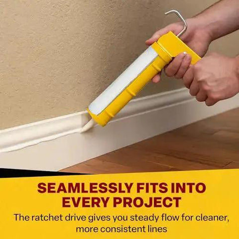 Contractor Grade Caulk Gun With 29 Oz Cartridge Capacity and Dripless Design for Minimal Mess in use along a floor edge.