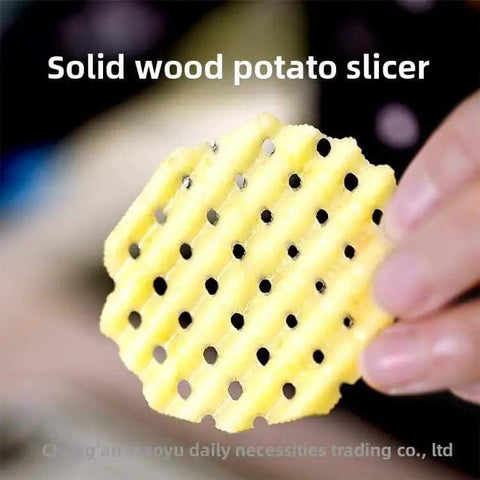 Hand holding crinkle-cut potato slice, showcasing result from Manual Stainless Steel Wave Cutter For Potatoes And Vegetables.