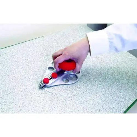 Hand using Beefy Aluminum Die Cast Circle Cutter With Adjustable 1.18 To 10.23 Inch Cutting Diameter on a surface