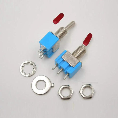 Two blue mini SPST toggle switches, front view, with red caps, 3 pins, threaded shafts; includes nuts and washers.