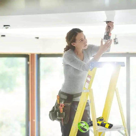 Person using a 4 1/8 Inch Carbide Hole Saw For Recessed Lights With Continuous Rim Cuts Plaster And Drywall Cleanly In Ceilings