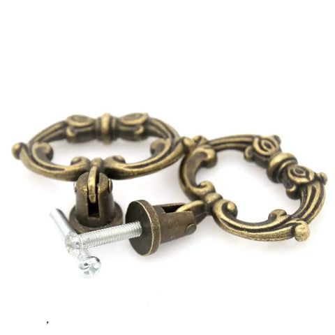 Close-up of 6 Sets Distressed Antique Brass Vintage Cabinet Pulls With Drop Ring Handles For Dresser Drawers And Cupboards 1.9 In By 1.8 In Zinc Alloy