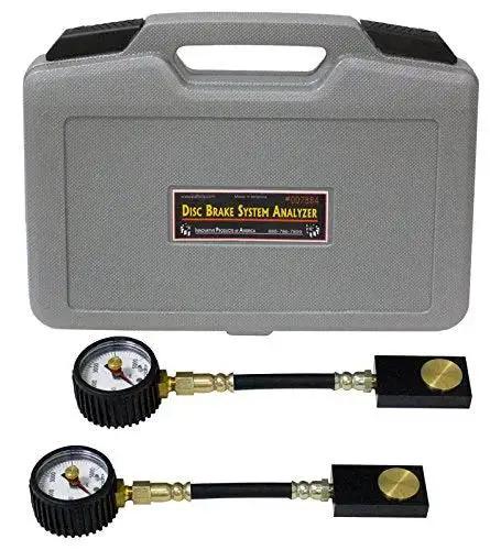 Disc brake system analyzer kit, front view, with two pressure gauges and hoses in a gray carrying case.