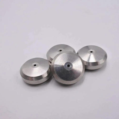 Four metal discs, part of the Three Pack Waterjet Cutting Machine Seat Seal 004003 1 Replacement Part For Precise Sealing And Leak Prevention Durable Spare Component For Reliable Waterjet Performance.