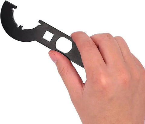 Hand holding Grunt Worthy Three Eighths Inch Drive Wrench Combo for removing and installing Castle DIN 1804 nuts using durable 45 steel