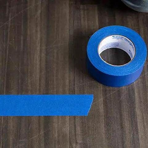 Clean Release Blue Painter's Tape 0.94 Inch Wide 60 Yards For Sharp Lines on wooden surface with tape strip visible