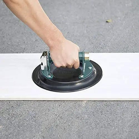 Close-up of 10 Inch Vacuum Suction Cup Lifter For Granite And Glass With Metal Handle And Brass Pump in use on white surface