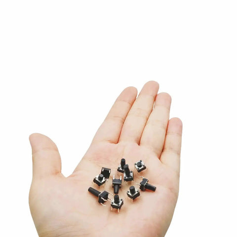 Hand holding miniature push buttons from 250 Piece 10 Value 6x6mm Tactile Push Button Switch Kit For Arduino And Breadboard Projects.