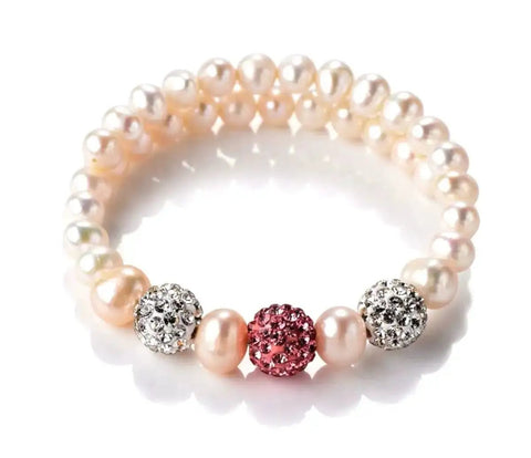 Pearl bracelet with crystal rhinestone disco ball beads and pink centerpiece