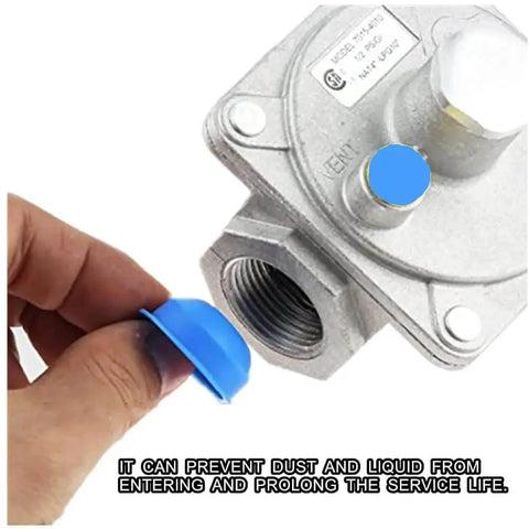 Natural Gas Pressure Regulator For Grill And Stove Lines With Three Quarter Inch FNPT Inlet, showing a protective cap being removed