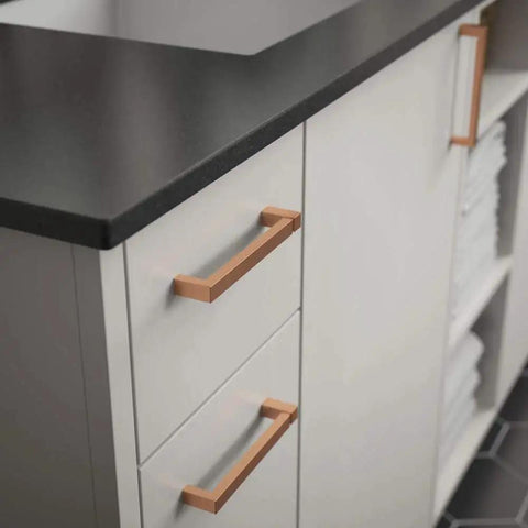 Installed copper notched cabinet pulls on white drawers, showing Copper Asymmetric Notched Cabinet Pull For Cabinets And Furniture.