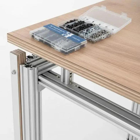 Ultimate M5 T Nut And Black Screw Kit For 6mm T Slot Aluminum Extrusion on wooden table with open case showing components