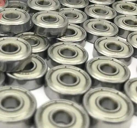 Close-up of multiple Miniature Deep Groove Ball Bearing 629ZZ 9x26x8mm Shielded Pieces in steel, ideal for RC and small machinery.