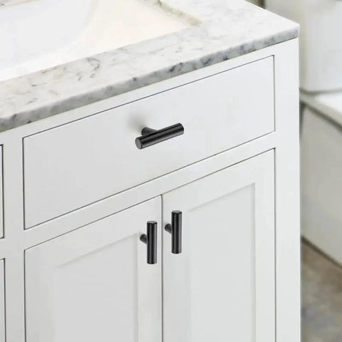 Matte Black 2 Inch Cabinet Knobs 30 Pack Stainless Steel Kitchen Cabinet Knobs With Round Edge installed on white bathroom drawers